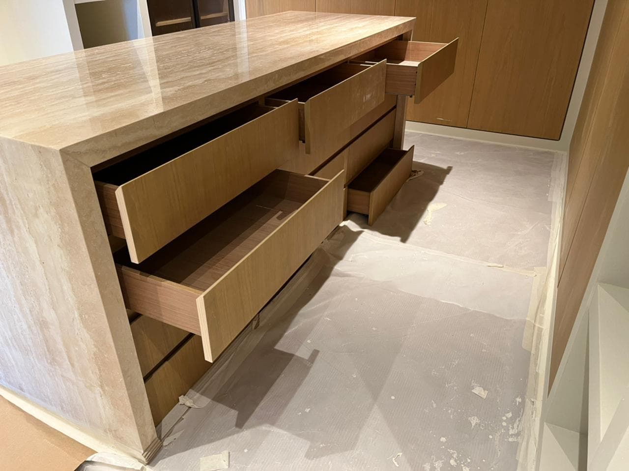 Bespoke stone-finish drawer unit with timber drawers made in the Creative Dimension workshop